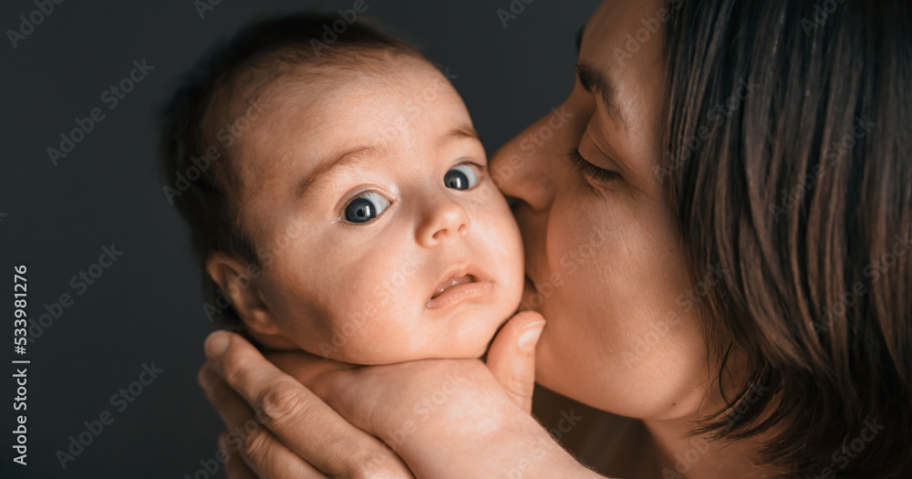 Mom, mummy, young mother with little baby daughter. Breast-feeding. Mum kissing,hugging child. Newborn cute happy girl smiling in woman hands. Family happiness. Age parents, parenting, motherhood Mom, mummy, young mother with little baby daughter. Breast-feeding. Mum kissing,hugging child. Newborn cute happy girl smiling in woman hands. Family happiness. Age parents, parenting, motherhood