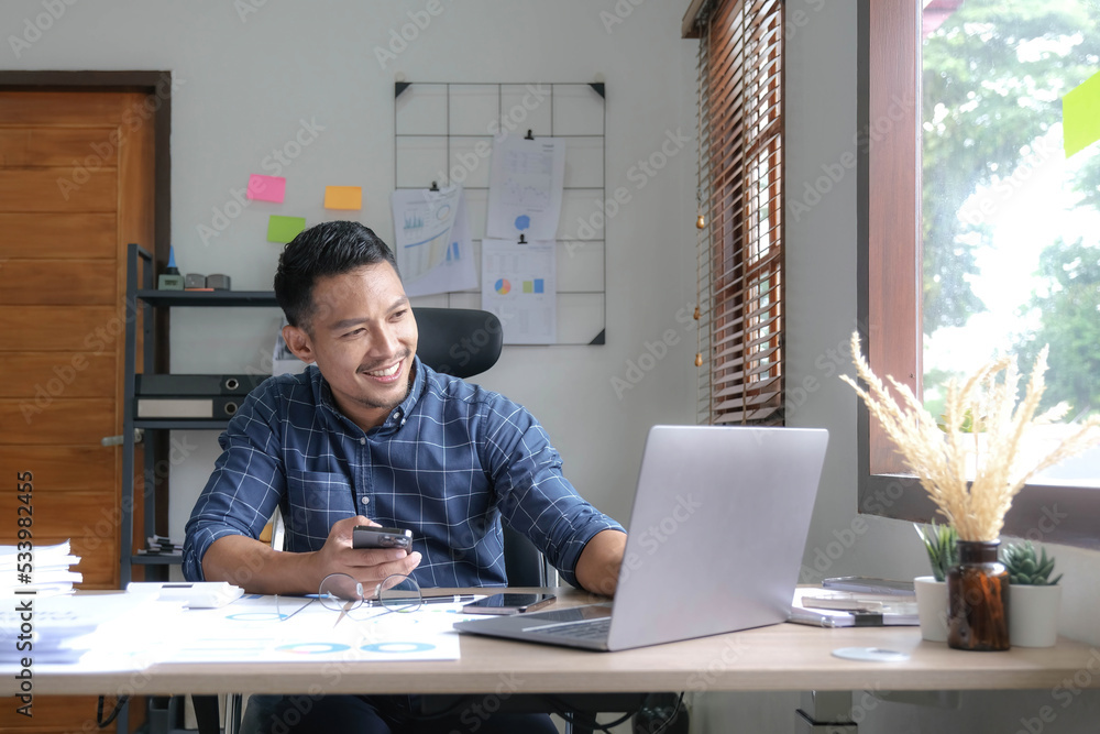 Male businessman and financial concepts about office work. Analysts discuss business with tablet and laptop Male businessman and financial concepts about office work. Analysts discuss business with tablet and laptop