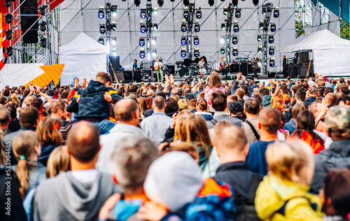 Принти на полотні many different people at a concert listening to rock band music open air