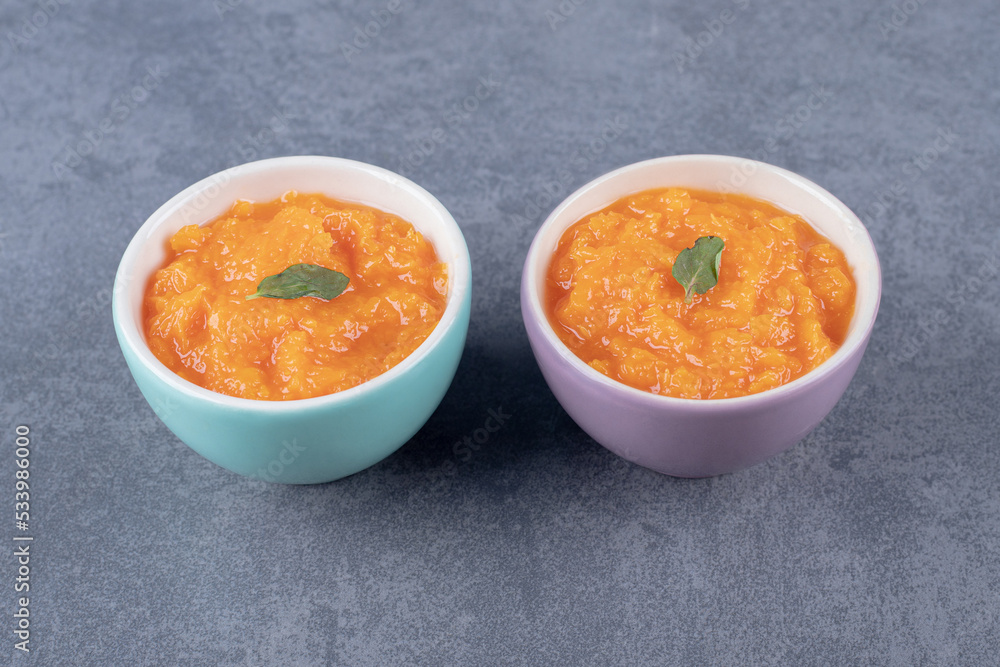 Two bowl of lentil soup, on the marble background Two bowl of lentil soup, on the marble background