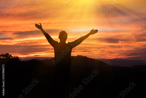The man raised his arms to the sky, he thanked God.