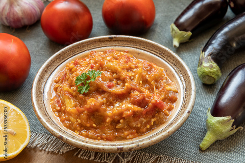 Eggplant and tomato salad Zaalouk dish in bowl. Homemade cooked vegetable salad from Moroccan cuisine. photo