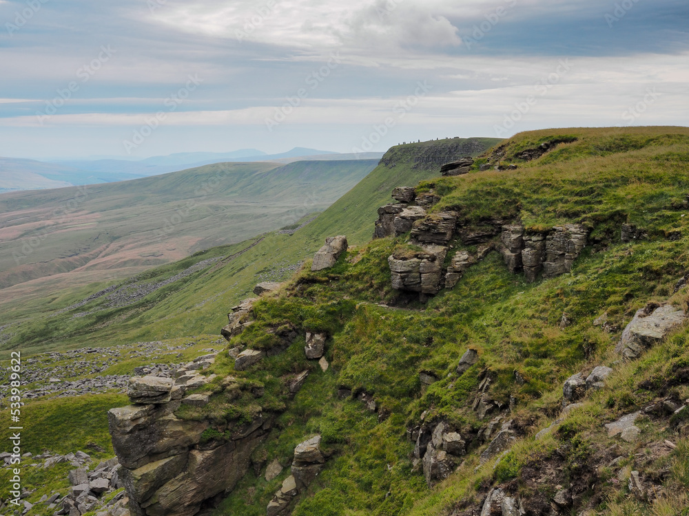Dramatic view from The Nab to the cairns at High White Scar next to Wild Boar Fell, overlooking the Eden Valley, Cumbria, UK Dramatic view from The Nab to the cairns at High White Scar next to Wild Boar Fell, overlooking the Eden Valley, Cumbria, UK