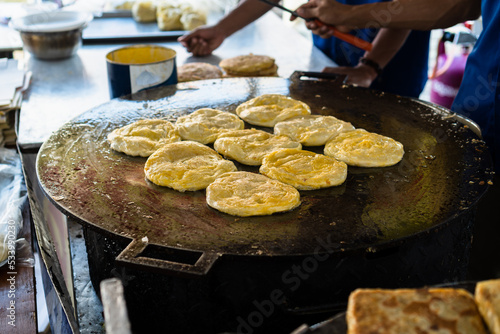 Frying Canai Bread or Roti Canai