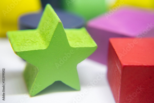 Group of objects of different geometric forms of wood, triangle, bucket, cylinder and rectangle on a white background