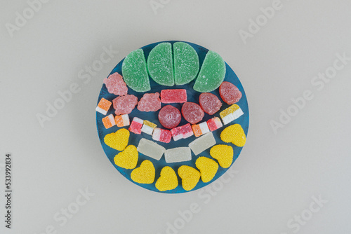 A wooden board full of sugary jelly candies