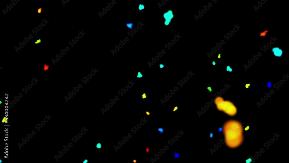 Futuristic particles of red, yellow, green, blue color move in the night space. 3D. 4K. Isolated black background. Futuristic particles of red, yellow, green, blue color move in the night space. 3D. 4K. Isolated black background.