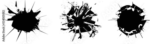 Broken glass, cracks, bullet marks on glass. Texture glass with black hole. 