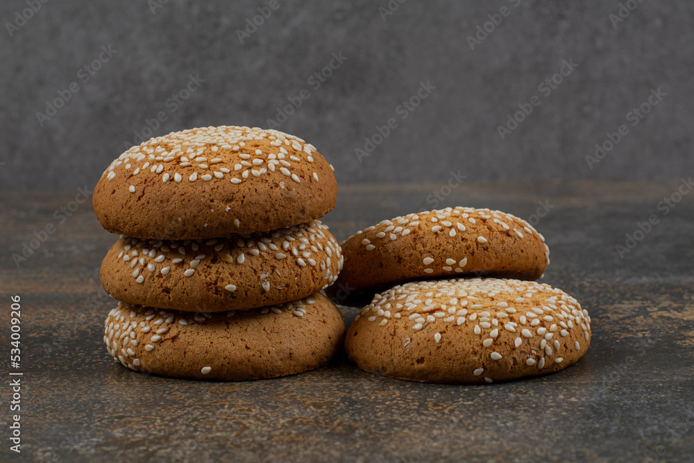 Cookies with sesame seeds on marble background