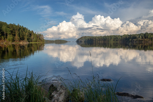 Landscape of lake under cloudy blue sky