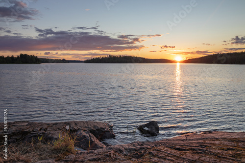 Sunrise over lake stony coast