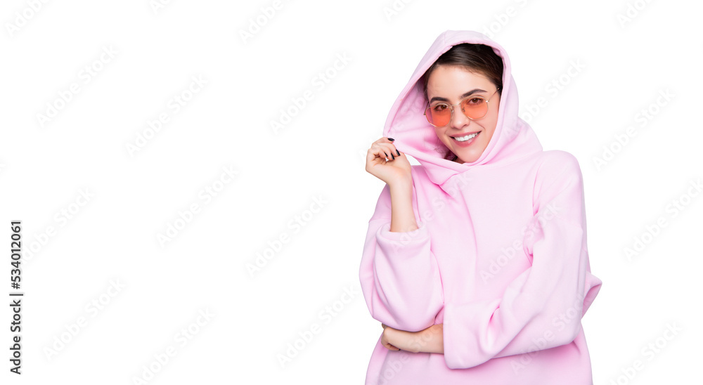 Fashion girl happy smiling in pink hoodie hooded sweatshirt isolated on white Fashion girl happy smiling in pink hoodie hooded sweatshirt isolated on white