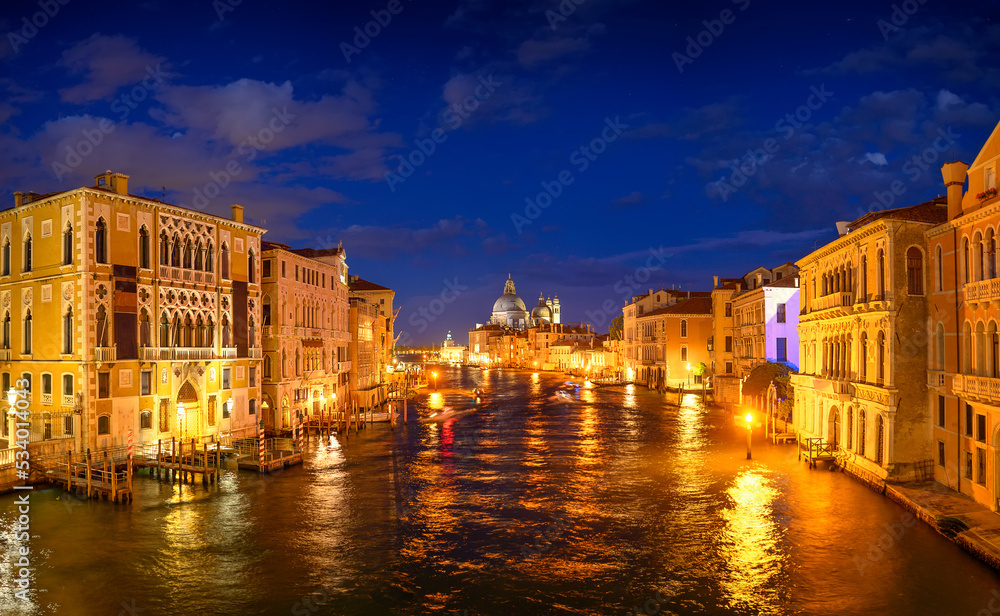 Night panorama of Grand Canal and Basilica Santa Maria della Salute in Venice, Italy. Summer holidays. Travel concept background.