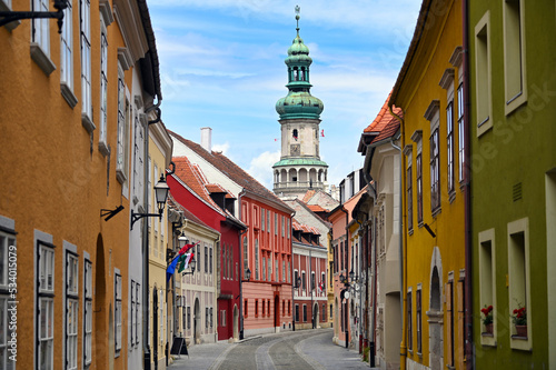 Street with old buildings and Firewatch tower in Sopron Hungary photo