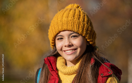 portrait of happy teen child at school time outdoor in autumn season