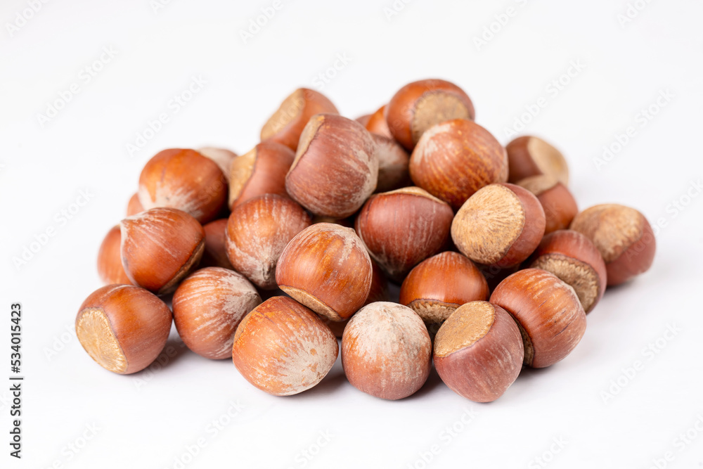 Shelled hazelnuts on the white background Shelled hazelnuts on the white background