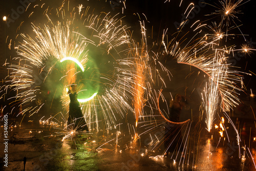 A beautiful fire show at a wedding as a gift to the newlyweds from their parents photo