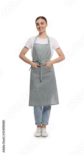 Beautiful young woman in clean apron on white background