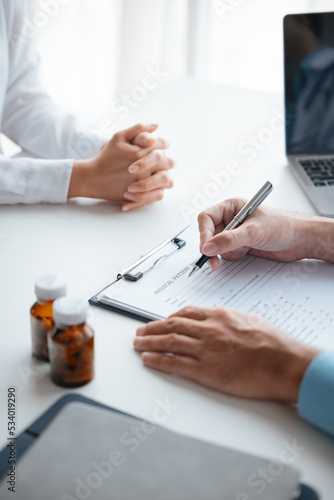 Close-up hands of doctor treatments and consults on patient in clinic medical office or hospital.