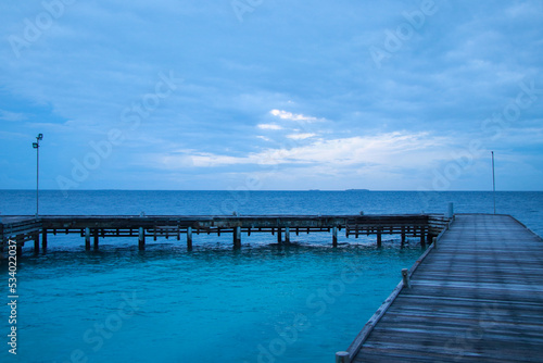 View of the pier and the ocean on a resort island in the Maldives