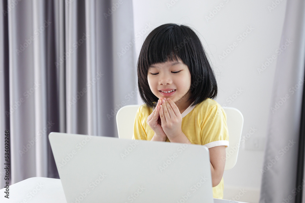 little asian girl student study online using laptop computer at home little asian girl student study online using laptop computer at home