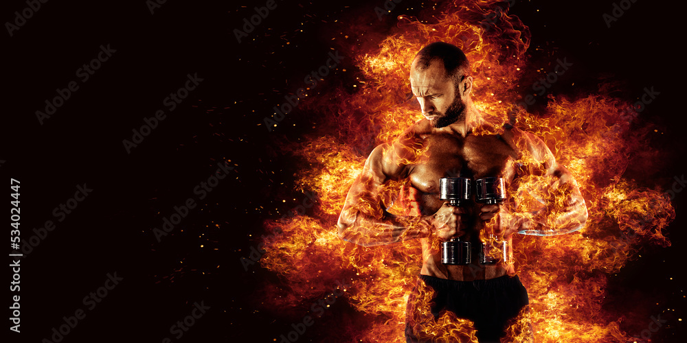 Fototapeta premium The shirtless abdominal male holds dumbbell. Studio shot in contrasty light