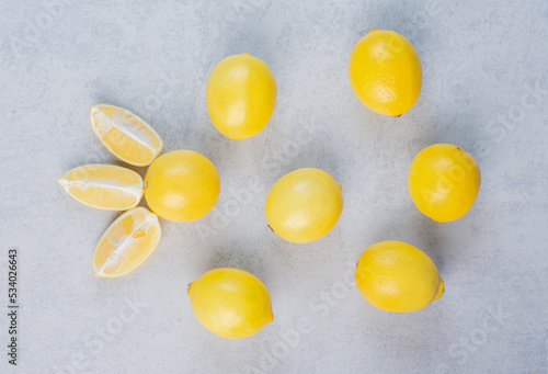 Composition of delicious citrus fruit on grey background