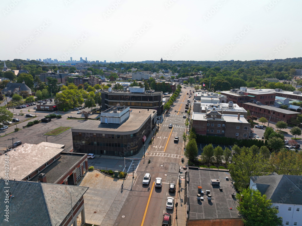 Watertown Main Street aerial view with Boston modern city skyline at the background in historic city center of Watertown, Massachusetts MA, USA. 