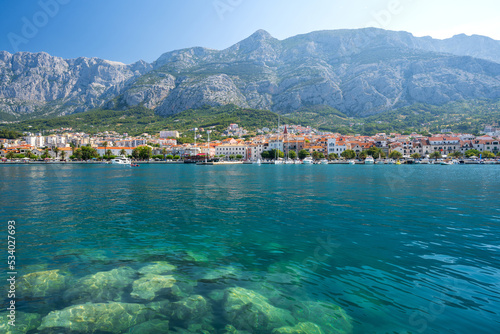view on Makarska town with azure adriatic sea and Biokovo mountains in Dalmatia region in Croatia