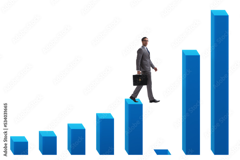 Businessman in growth concept with bar charts Businessman in growth concept with bar charts