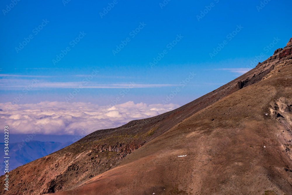 Panoramic view form mountains peak on the fog and clouds. Sunrise landscape. 