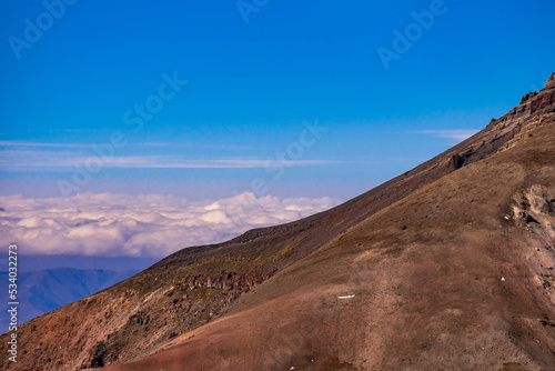 Panoramic view form mountains peak on the fog and clouds. Sunrise landscape. 