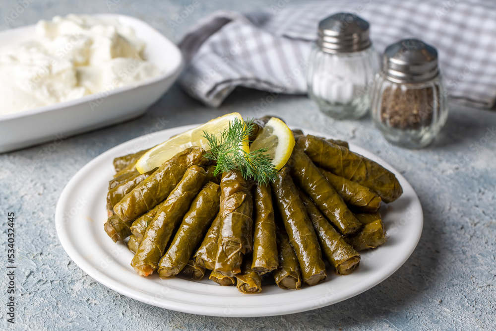 Delicious dolma (sarma) stuffed grape leaves rice. Lebanese dolma sarma on plate. Lebanon turkish greek middle eastern cuisine. (Turkish name; Yaprak sarma)