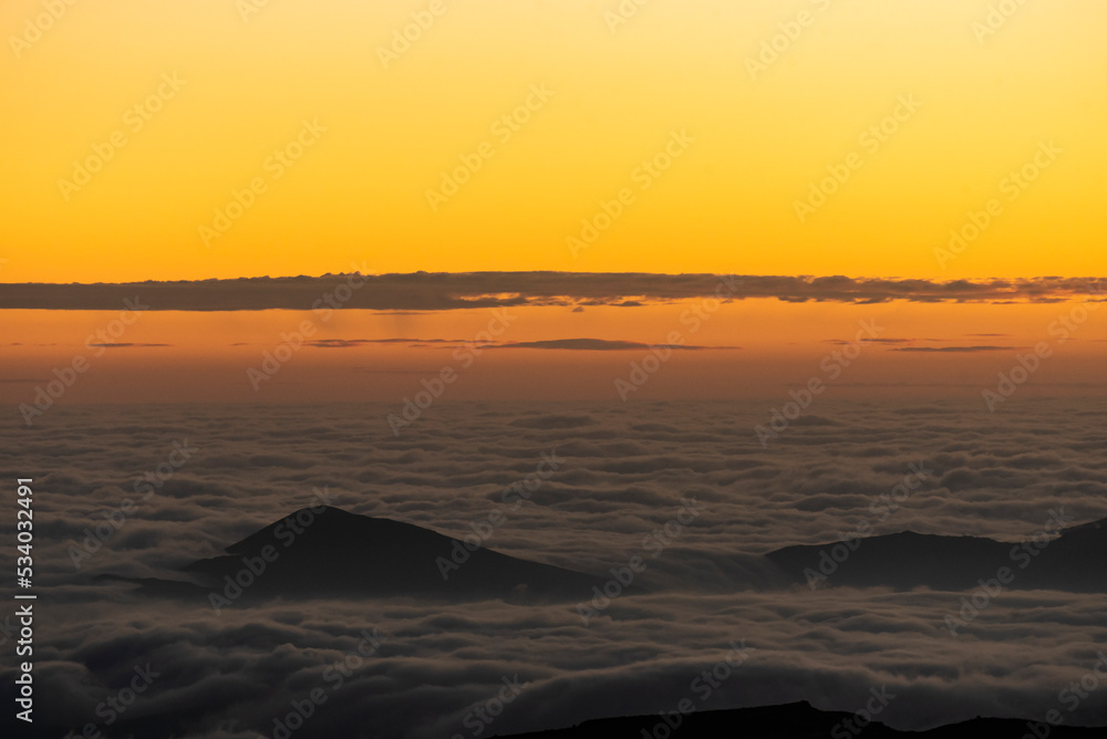 Panoramic view form mountains peak on the fog and clouds. Sunrise landscape.