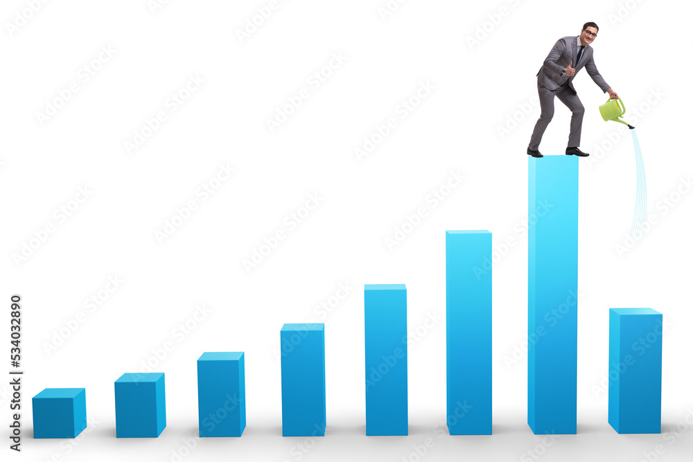 Businessman in investment growth concept with watering can Businessman in investment growth concept with watering can