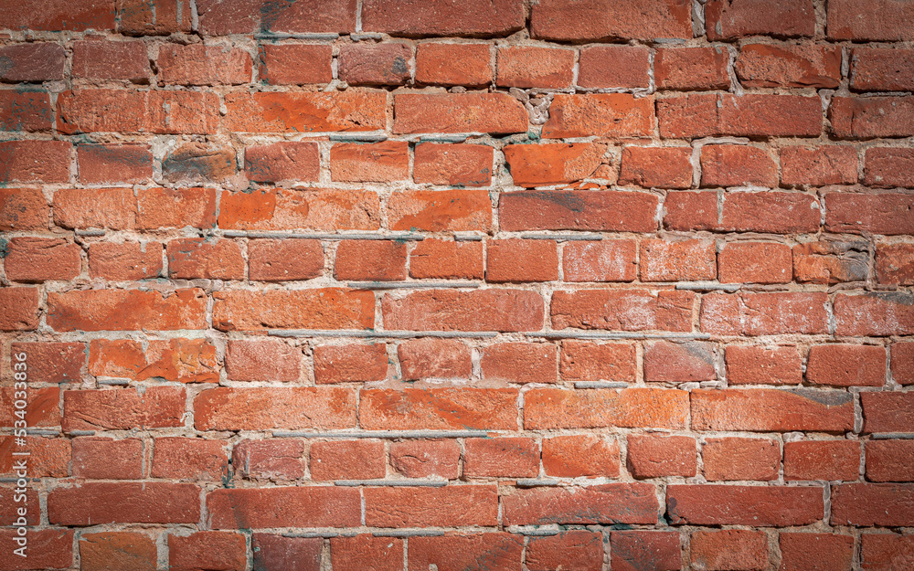 Old red brick wall grunge texture. Old cracked bricks wall with a weathered surface with with vignetted corners Old red brick wall grunge texture. Old cracked bricks wall with a weathered surface with with vignetted corners
