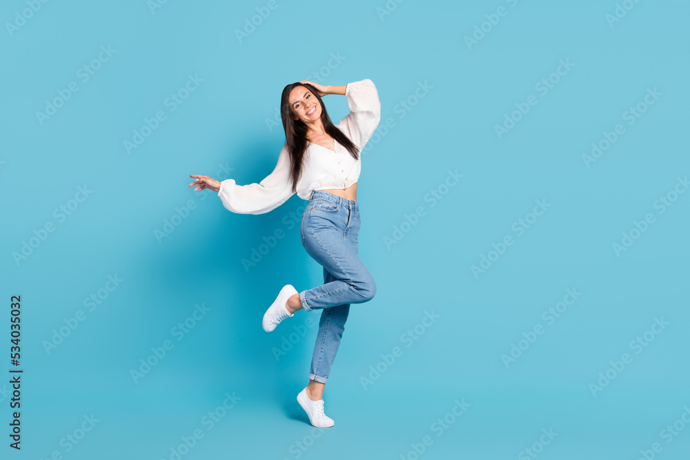 Full size portrait of stunning satisfied dancing partying spend free time isolated on blue color background Full size portrait of stunning satisfied dancing partying spend free time isolated on blue color background