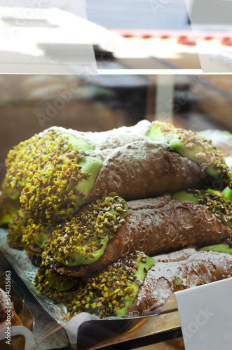 Canolli Sicilian with pistachio cream traditional Italian sweets.