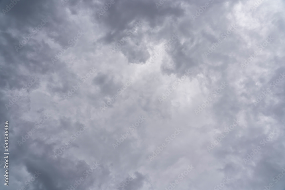 Storm clouds are clearing in the center to allow sunlight to penetrate Storm clouds are clearing in the center to allow sunlight to penetrate