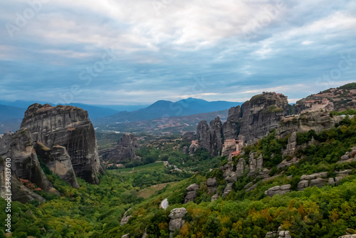 Main observation deck of Meteora with panoramic view of smooth rock pinnacles formation and the Holy Eastern Orthodox Monasteries in Kalambaka, Meteora, Thessaly, Greece, Europe. Dramatic landscape