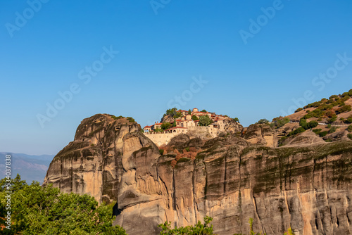 Scenic sunrise view of Holy Monastery of Great Meteoron (Meteoro Monastery, Megalo Meteoron) near Kalambaka, Meteora, Thessaly, Greece, Europe. Dramatic landscape. Orthodox landmark build on rock