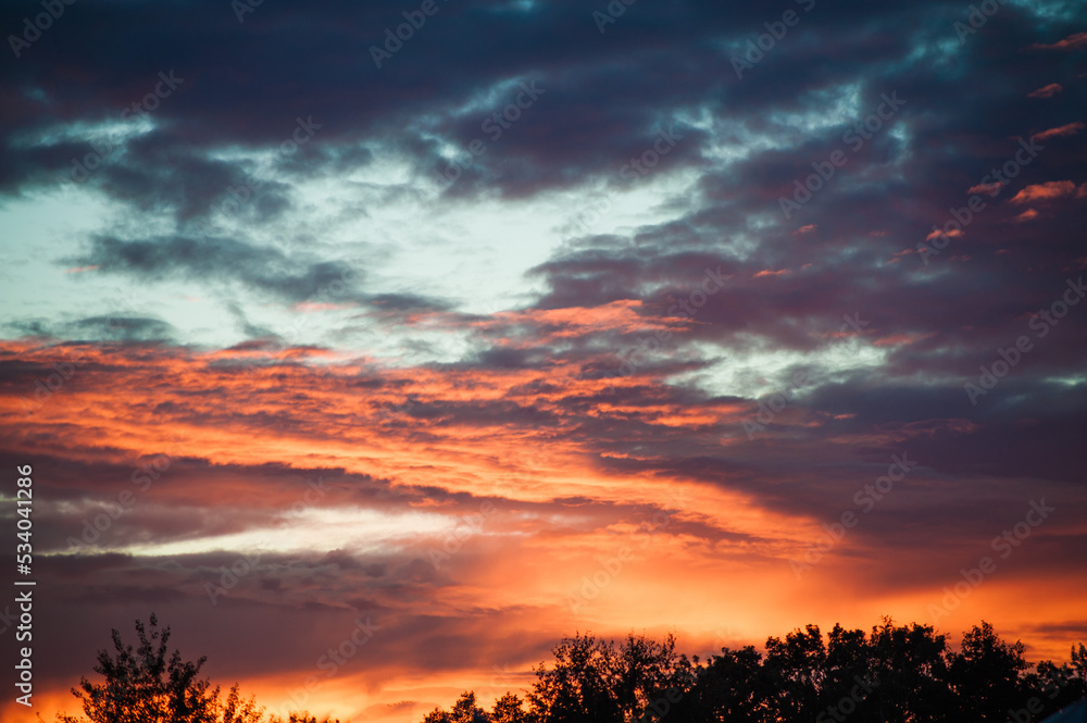 Fototapeta premium Sunset sunrise with clouds, light rays and other atmospheric effect