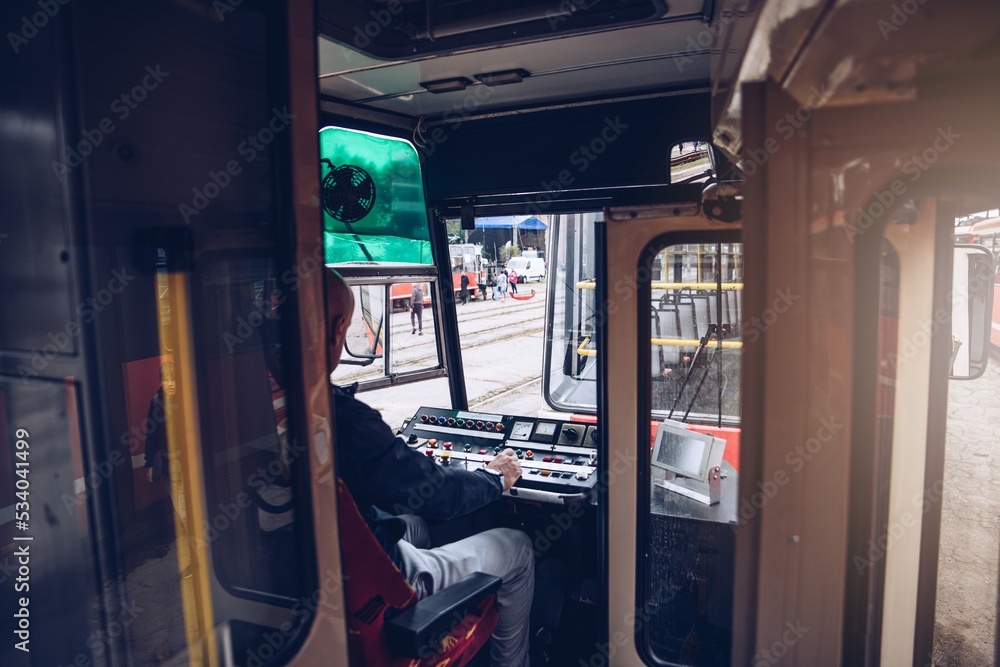 Obraz premium Tram driver runs the tram. Public transport