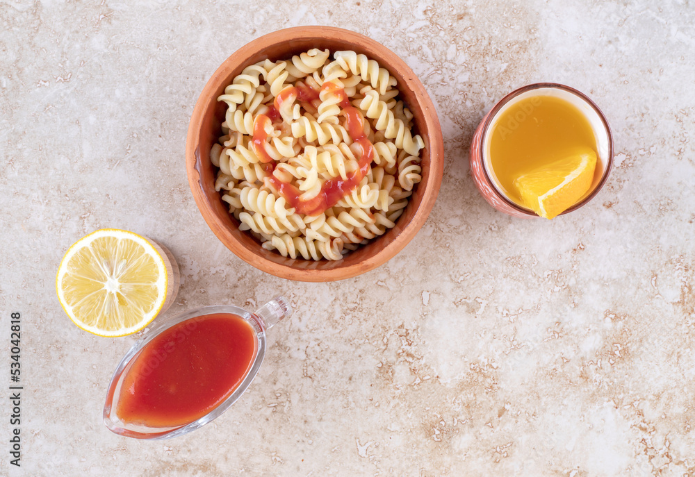 A clay bowl of delicious pasta with various vegetables A clay bowl of delicious pasta with various vegetables
