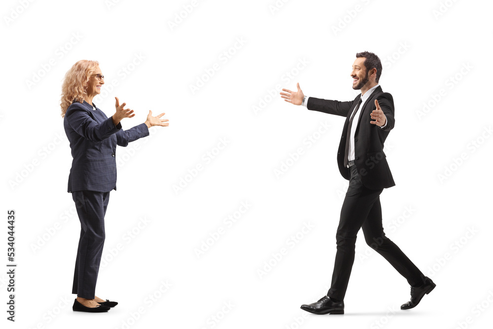 Full length profile shot of a businessman walking towards a woman with arms wide open Full length profile shot of a businessman walking towards a woman with arms wide open