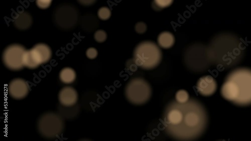 Golden glowing bokeh. Christmas light, bokeh. Blurred motion. Golden Christmas light.