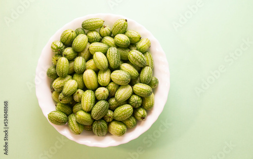 Cucamelon (Melothria scabra) - edible Mexican miniature watermelon - cucumber. Mini watermelon cucumbers have a delicious taste with sourness. photo