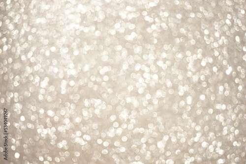 Shiny blurred beige background with round bubbles