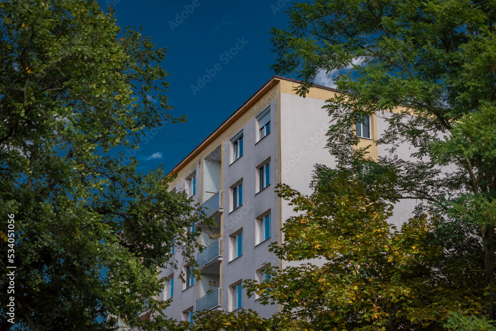 Block of flats with blue sky and sunny autumn clear day in Rakovnik town