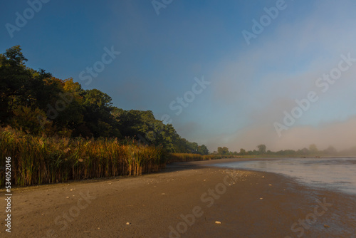 Fototapeta Naklejka Na Ścianę i Meble -  Mlynsky pond in autumn foggy morning near Lednice town